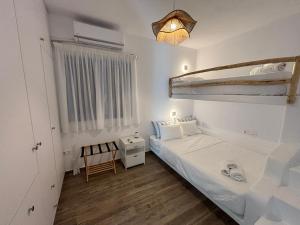 Postel nebo postele na pokoji v ubytování Paros Relux