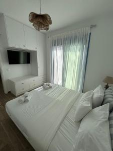 Postel nebo postele na pokoji v ubytování Paros Relux