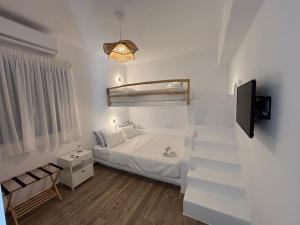 Postel nebo postele na pokoji v ubytování Paros Relux