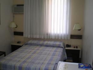 Cama ou camas em um quarto em Hotel São Bento