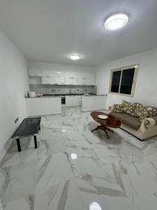 a living room with a marble floor at Villa Cepeli in Golemasi +9 photos