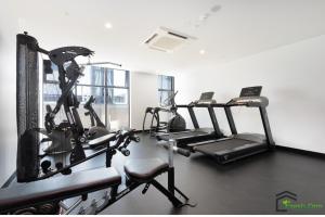 a gym with three tread machines in a room at Exquisite And Warm 1br Nest In Footscray Pool Gym in Melbourne