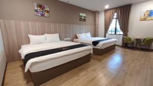 Postel nebo postele na pokoji v ubytování Maple Boutique Hotel