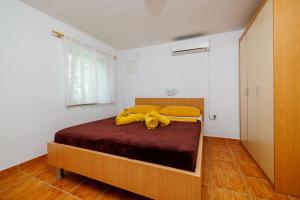 Postel nebo postele na pokoji v ubytování Apartments Iva