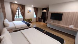 TV a/nebo společenská místnost v ubytování Maple Boutique Hotel