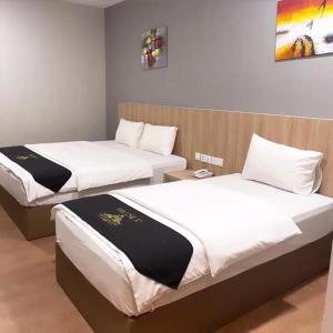 Postel nebo postele na pokoji v ubytování Maple Boutique Hotel