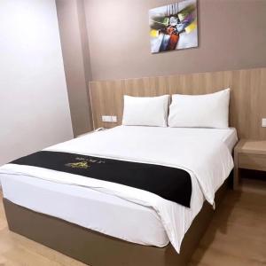 Postel nebo postele na pokoji v ubytování Maple Boutique Hotel