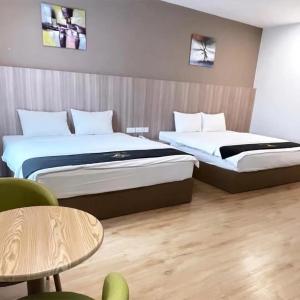 Postel nebo postele na pokoji v ubytování Maple Boutique Hotel