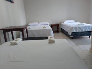 Giường trong phòng chung tại Residencia Familiar Galeon