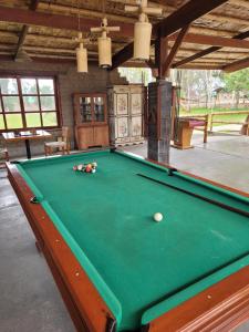 a green pool table with a ball on it at Bungalows de Casa Verde in Mala +64 photos