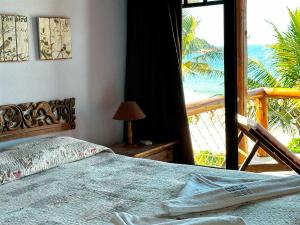 Ένα ή περισσότερα κρεβάτια σε δωμάτιο στο Pousada Pedra da Gaivota +137 φωτογραφίες