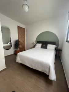 Ένα ή περισσότερα κρεβάτια σε δωμάτιο στο Am Cinco Condesa