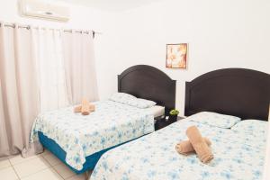 Vuode tai vuoteita majoituspaikassa WE Hotel, La Lima