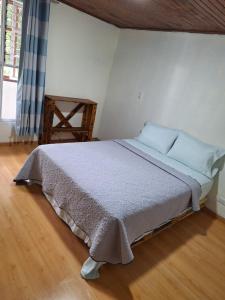 Ένα ή περισσότερα κρεβάτια σε δωμάτιο στο Carolina Hostel