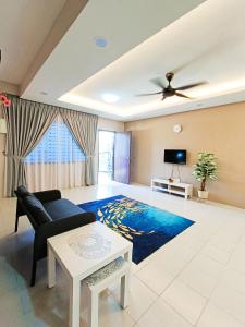 a living room with a couch and a table at Zen Clan Homestay Scientex with wifi, aircond, water heater in Pasir Gudang