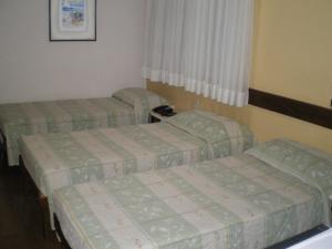 Cama ou camas em um quarto em Hotel São Bento