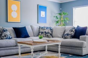 a living room with a couch and a coffee table at Gameroom, Bbq & Hot-tub By Lackland & Seaworld in San Antonio +65 photos