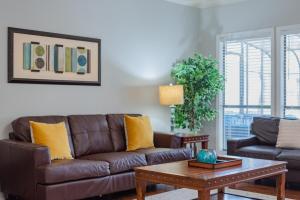 a living room with a couch and a coffee table at Beautiful Home With Sunroom, Gameroom, Yard & Bbq in San Antonio +81 photos