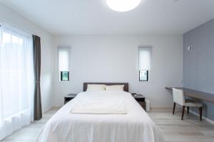 Mova Villa Ozu客房内的一张或多张床位