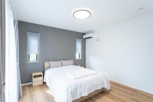 Mova Villa Ozu客房内的一张或多张床位