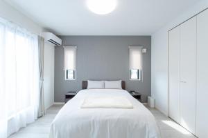 Mova Villa Ozu客房内的一张或多张床位