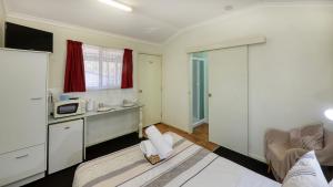 Kuchyň nebo kuchyňský kout v ubytování Silver Wattle Cabins