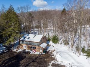 an aerial view of a house in the snow at HappyCub- AC, Hot Tub, Fire Pit, Game Room! in Killington