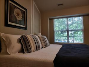 Ένα ή περισσότερα κρεβάτια σε δωμάτιο στο Great Getaway Charlotte