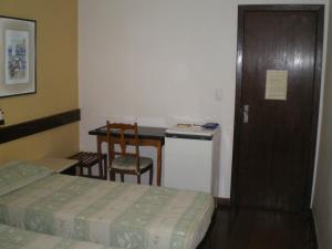 Cama ou camas em um quarto em Hotel São Bento