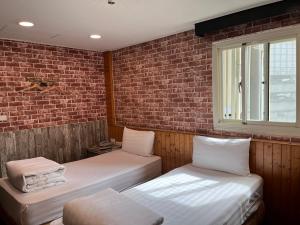 Bin Chen Business Hotelにあるベッド