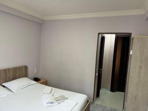 Postel nebo postele na pokoji v ubytování Hotel Skib