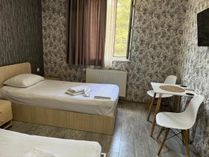 Postel nebo postele na pokoji v ubytování Hotel Skib