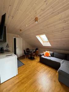a living room with a couch and a table at Kopa Cabana in Palanga
