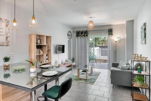 a living room with a table and a couch at Lacaze Salazie in Hell-Bourg