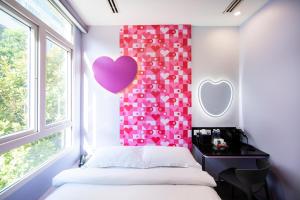 Ένα ή περισσότερα κρεβάτια σε δωμάτιο στο Fragrance Hotel - Lavender +28 φωτογραφίες