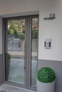 a door of a building with a plant next to it at Case Vacanza IGNAZIO SILONE in Celano