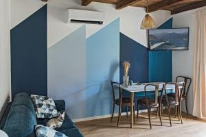 a living room with a couch and a table at LevOasi 9 - Lake and mountains escape in Levo