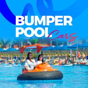 two women riding on an orange rubber boat in the water at Pickalbatros Jungle Aqua Park - Neverland Hurghada in Hurghada