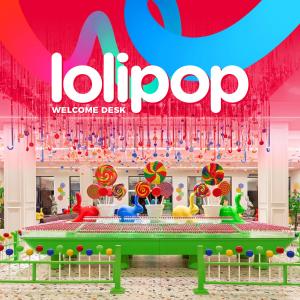 a store with a lollipop display with a red sign at Pickalbatros Jungle Aqua Park - Neverland Hurghada in Hurghada