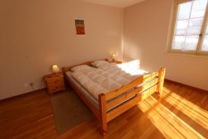 Postel nebo postele na pokoji v ubytování Chalet Les Arolles