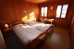 Postel nebo postele na pokoji v ubytování Chalet Les Arolles