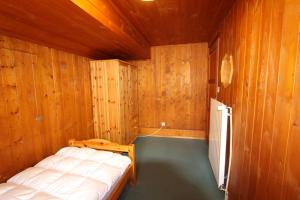 Postel nebo postele na pokoji v ubytování Chalet Les Arolles