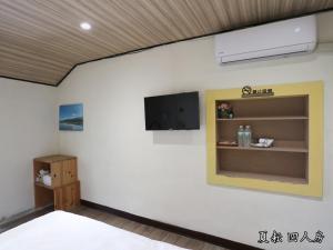 Postel nebo postele na pokoji v ubytování 玉蟾園民宿 寵物友善 YuChanYuan B&B