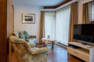 TV a/nebo společenská místnost v ubytování Haus Amici + 10 fotografií