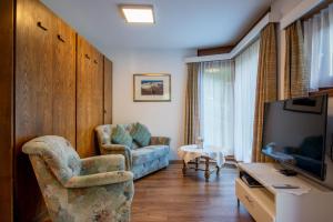 TV a/nebo společenská místnost v ubytování Haus Amici