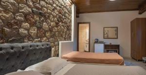 Postel nebo postele na pokoji v ubytování Liontos Rooms
