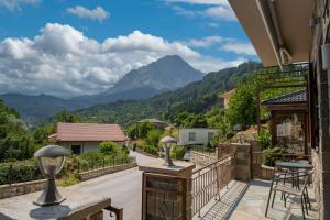 a balcony with a view of a mountain at Liontos Rooms in Pramanta