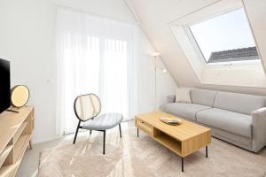 A seating area at STAYY Flagship Limmattal - contactless check-in