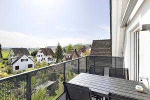 A balcony or terrace at STAYY Flagship Limmattal - contactless check-in
