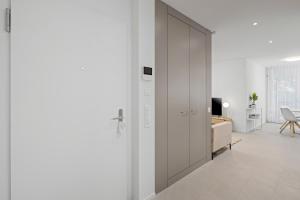 A television and/or entertainment centre at STAYY Flagship Limmattal - contactless check-in